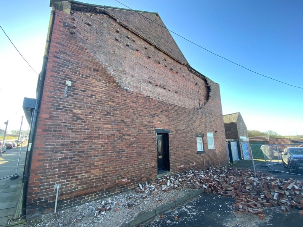Gable end wall tie failure
